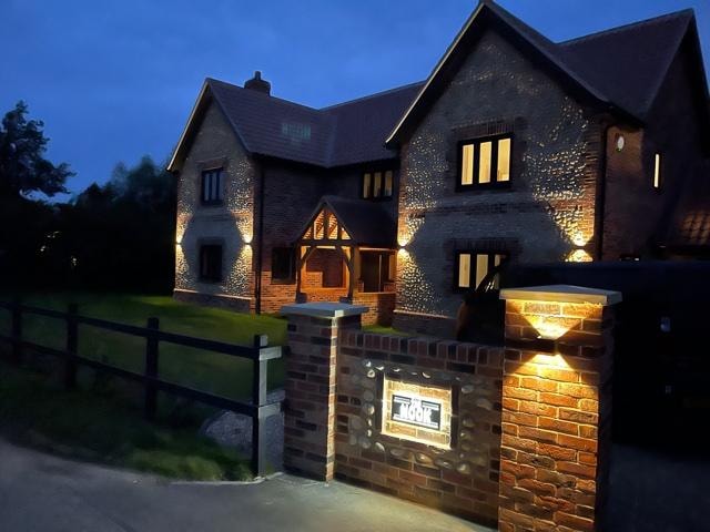 The Nook — exterior illuminated at dusk